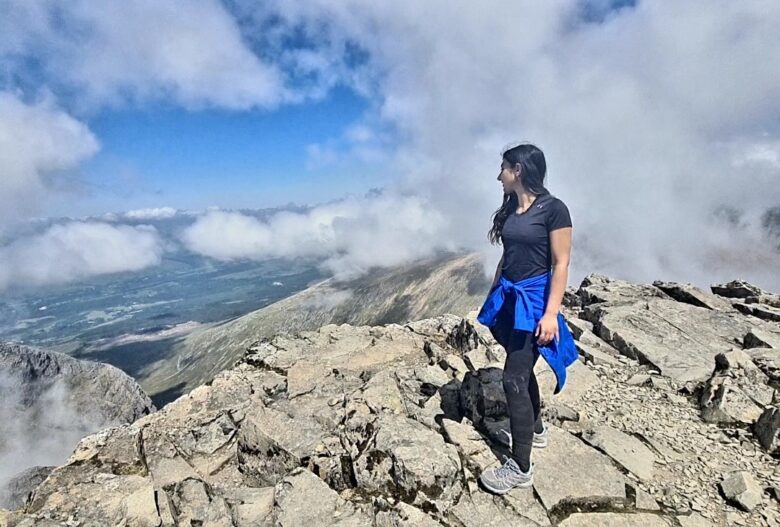 Sara stands at the summit of Ben Nevis.