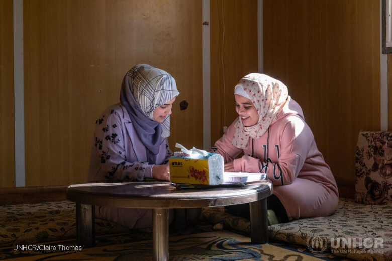 Two girls studying together. 